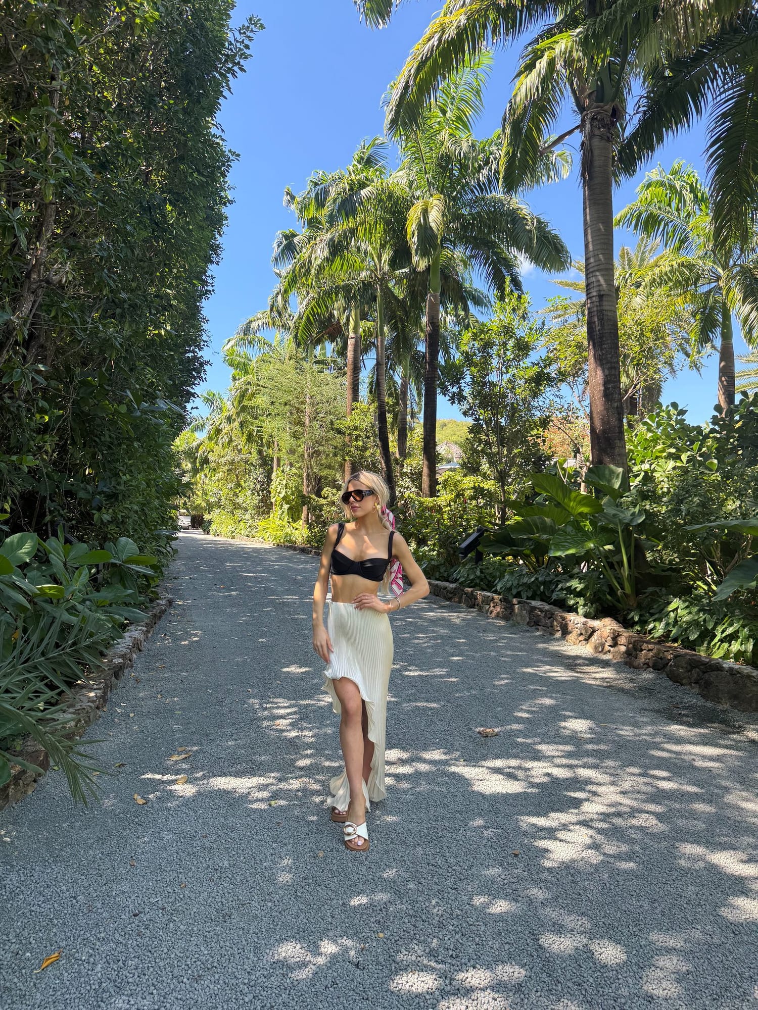 Brooke on a palm-lined walk